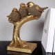 Декоративна фигурка три птици на клон Декоративна фигурка на три златни птици на клон като подарък за жена.